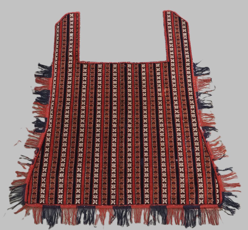 Hand-woven red, dark navy, and ivory striped Turkmen wool horse cover featuring geometric motifs and fringe along the lower edges.