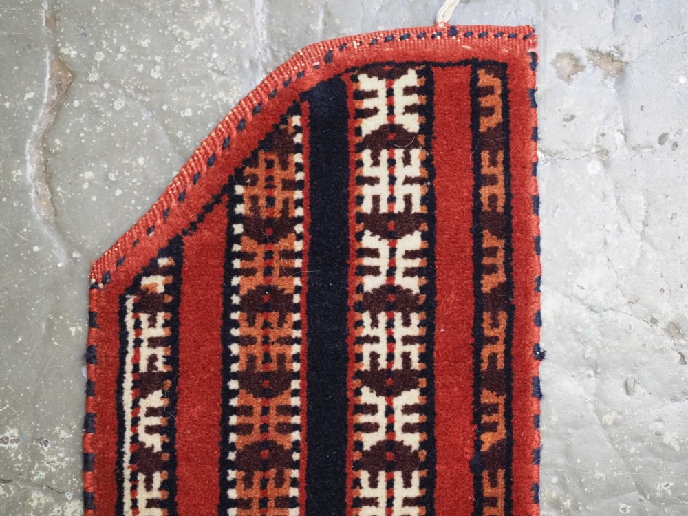 Hand-woven red, dark navy, and ivory striped Turkmen wool horse cover featuring geometric motifs and fringe along the lower edges. View V