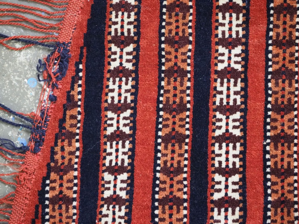 Hand-woven red, dark navy, and ivory striped Turkmen wool horse cover featuring geometric motifs and fringe along the lower edges. View VII