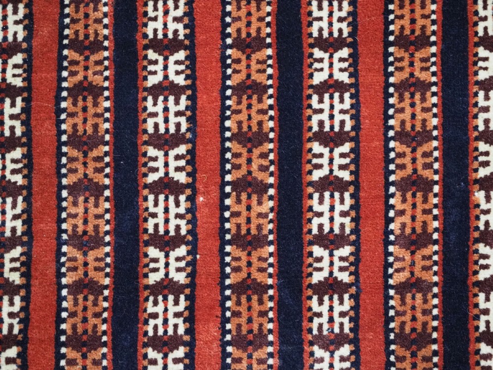 Hand-woven red, dark navy, and ivory striped Turkmen wool horse cover featuring geometric motifs and fringe along the lower edges. View IX