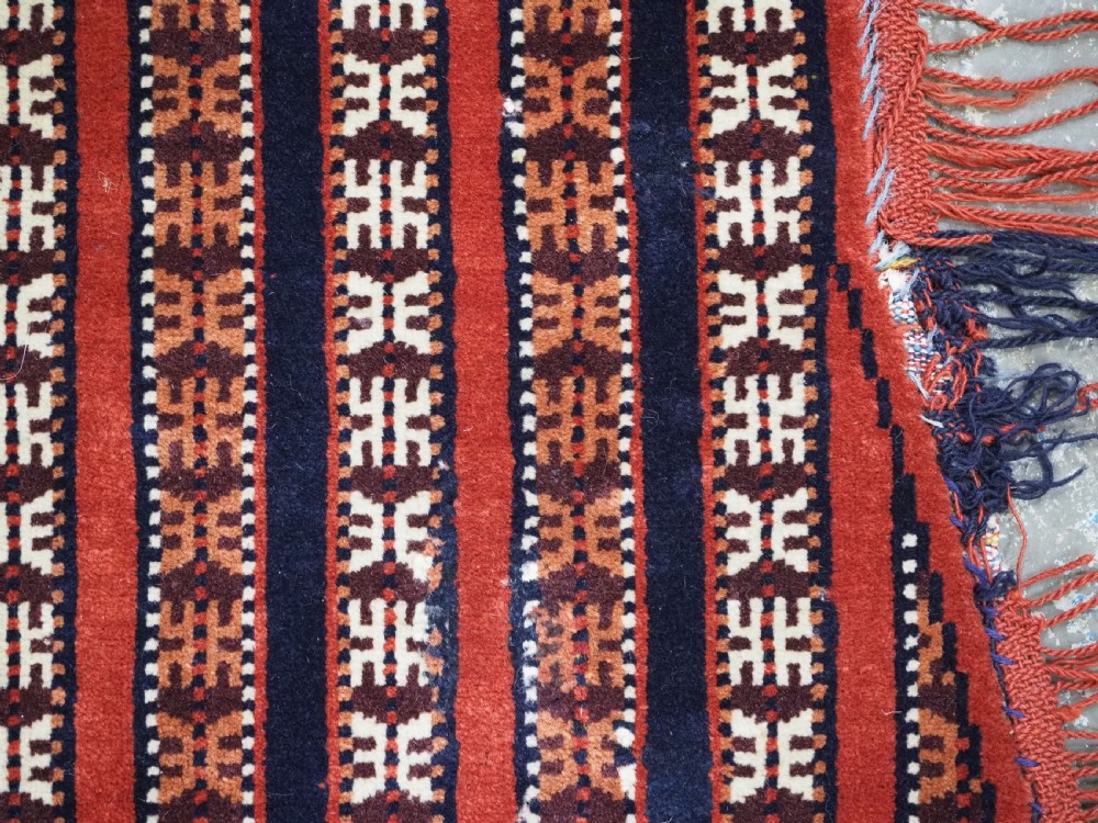 Hand-woven red, dark navy, and ivory striped Turkmen wool horse cover featuring geometric motifs and fringe along the lower edges. View X