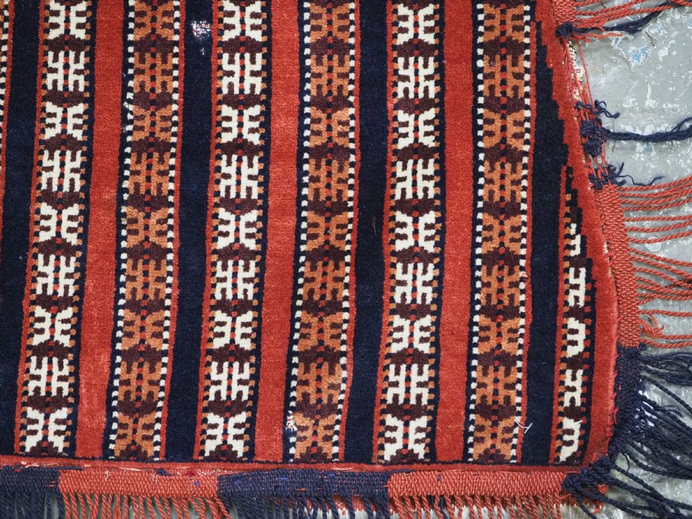 Hand-woven red, dark navy, and ivory striped Turkmen wool horse cover featuring geometric motifs and fringe along the lower edges. View XI
