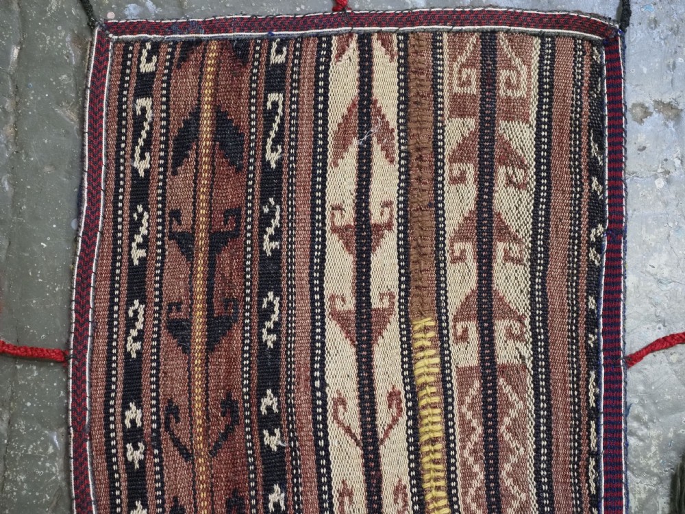 A flat-weave woven wool Northern Afghan ceremonial horse blanket featuring brown, cream, red, and blue geometric stripes with wool tassels along the edges. View III
