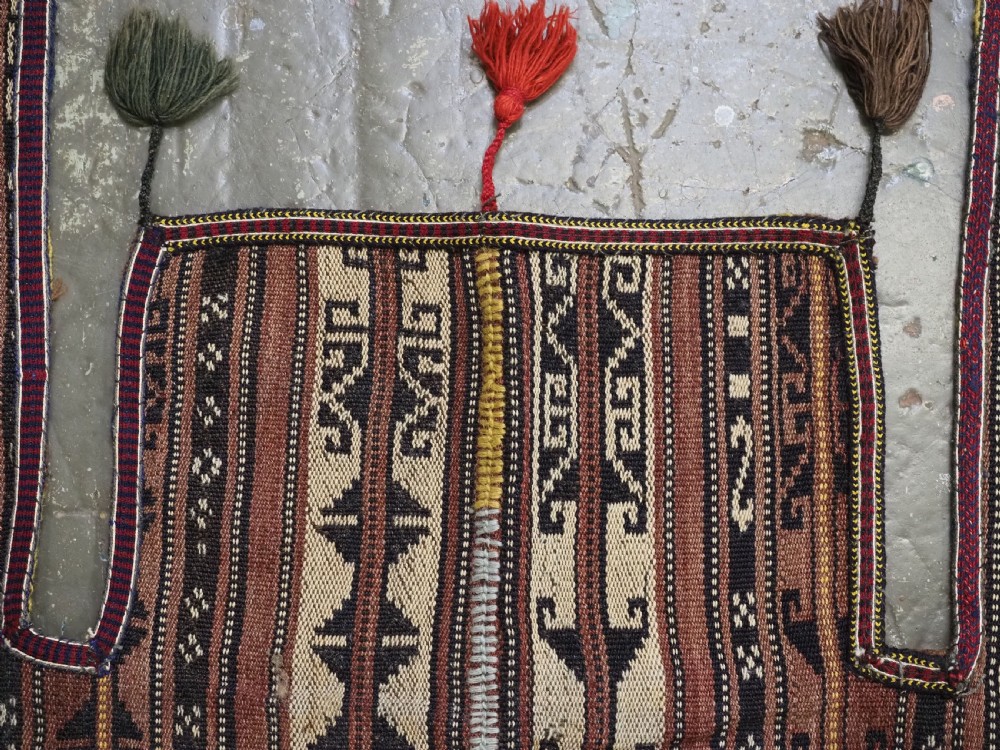 A flat-weave woven wool Northern Afghan ceremonial horse blanket featuring brown, cream, red, and blue geometric stripes with wool tassels along the edges. View V