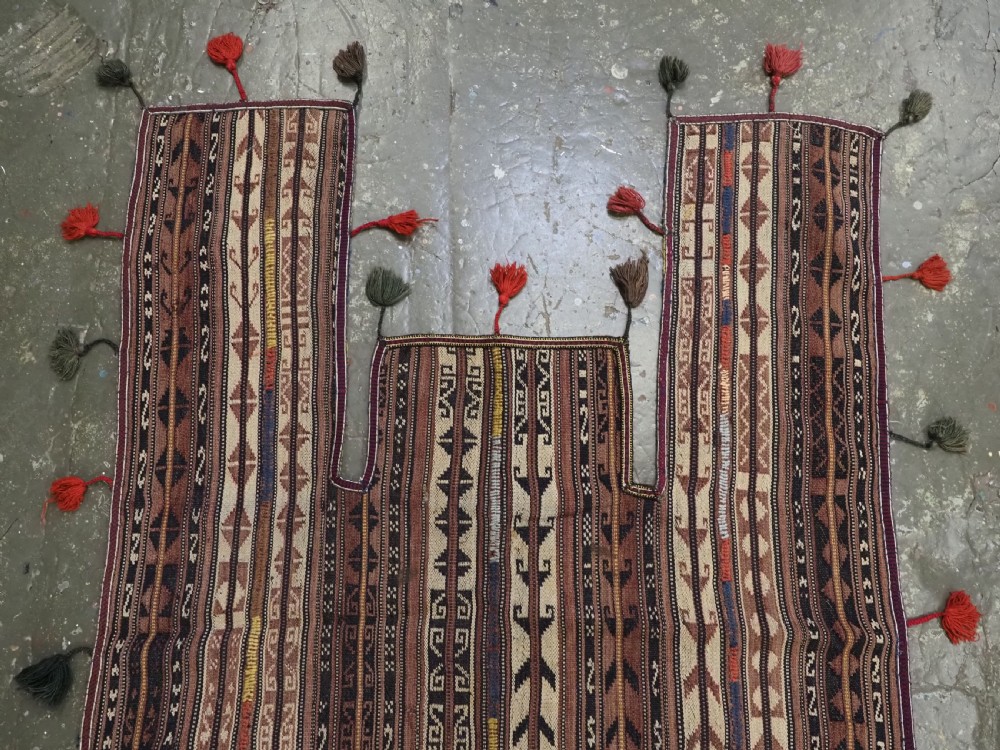 A flat-weave woven wool Northern Afghan ceremonial horse blanket featuring brown, cream, red, and blue geometric stripes with wool tassels along the edges. View VI
