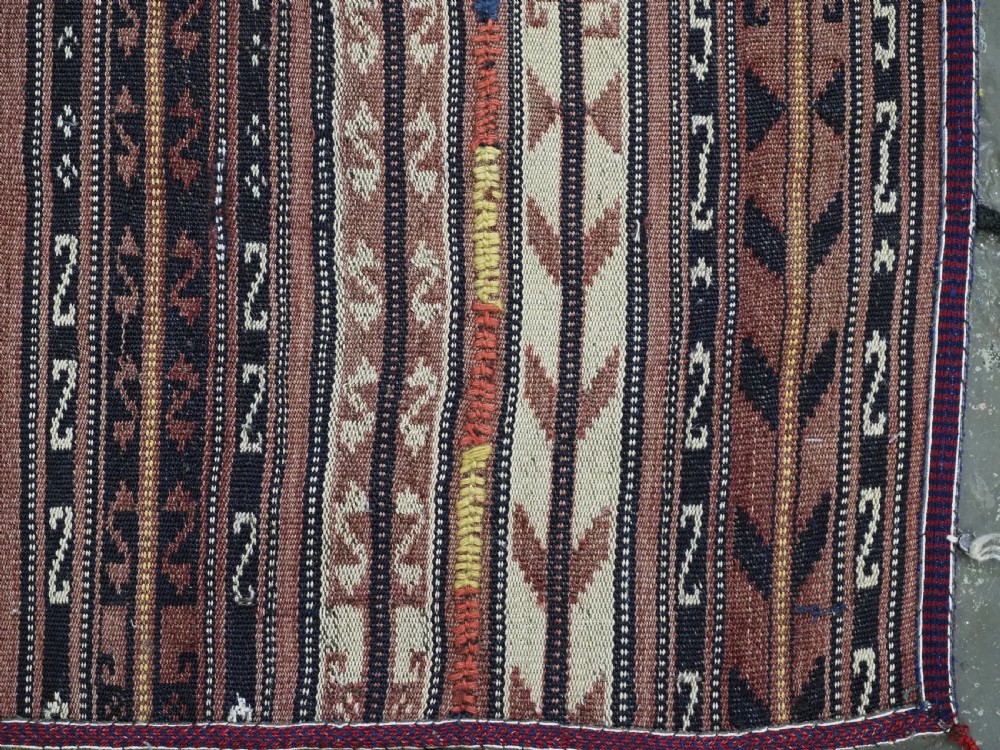 A flat-weave woven wool Northern Afghan ceremonial horse blanket featuring brown, cream, red, and blue geometric stripes with wool tassels along the edges. View XII