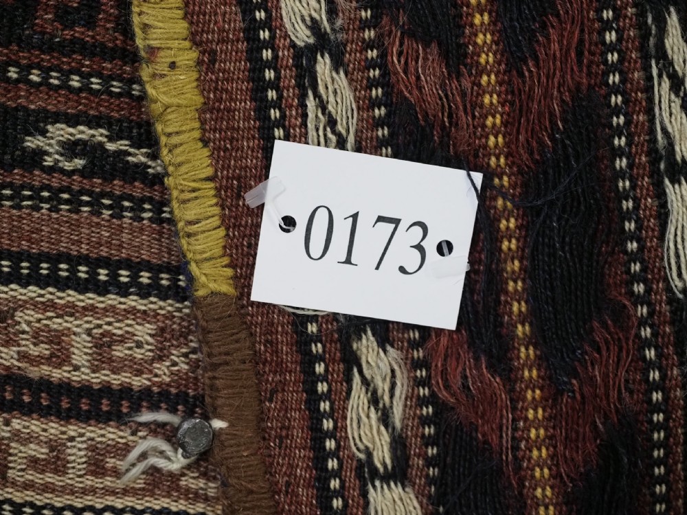 A flat-weave woven wool Northern Afghan ceremonial horse blanket featuring brown, cream, red, and blue geometric stripes with wool tassels along the edges. View XIV