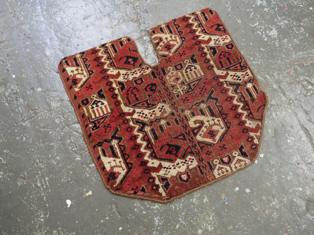 A late nineteenth-century Ersari Beshir Turkmen saddle rug featuring red, cream, and dark navy geometric patterns with a central top notch. View II