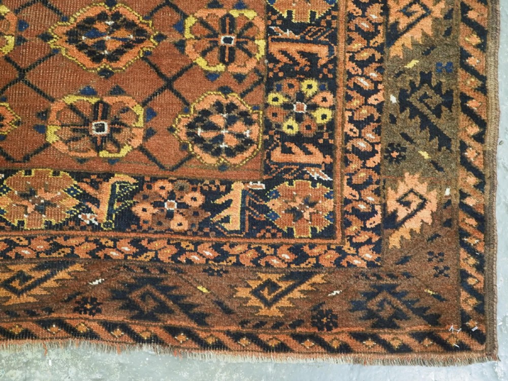 An antique Afghan Ersari Turkmen hand-knotted wool carpet featuring a repeating lattice grid with rosettes in terracotta red, dark blue, and yellow accents. View XI