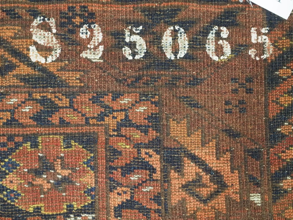 An antique Afghan Ersari Turkmen hand-knotted wool carpet featuring a repeating lattice grid with rosettes in terracotta red, dark blue, and yellow accents. View XII
