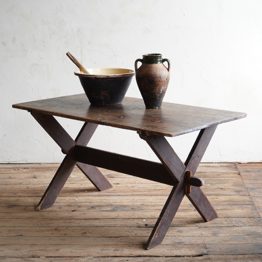 A rustic dark timber tavern table featuring an X-frame trestle base connected by a central horizontal stretcher. View II