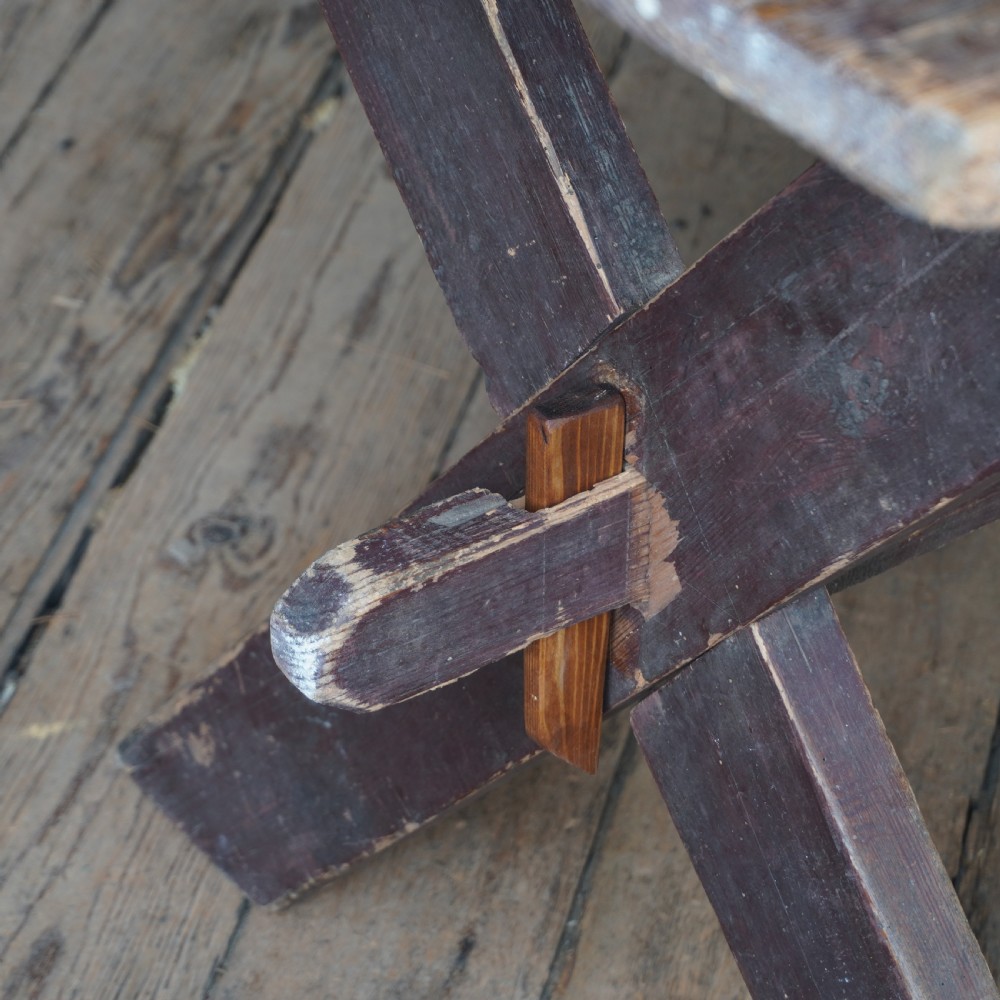 A rustic dark timber tavern table featuring an X-frame trestle base connected by a central horizontal stretcher. View VIII