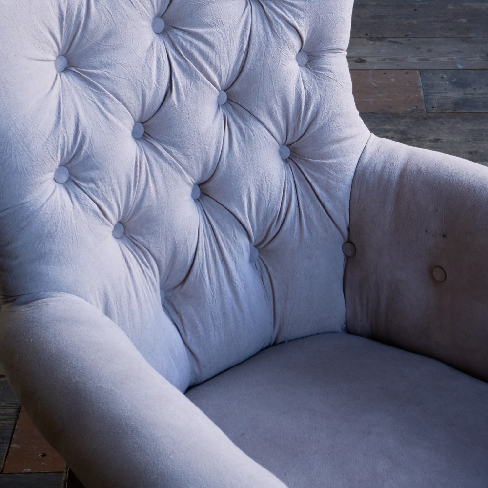 A Regency period button-backed armchair upholstered in pale grey fabric with lyre-shaped front arm supports and turned mahogany legs on brass castors. View VII