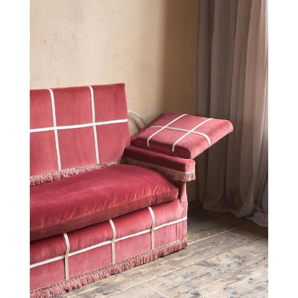 A claret red velvet Knole sofa featuring grid pattern braid trim, fringe edging, and adjustable drop-down armrests with metal ratchets. View XI
