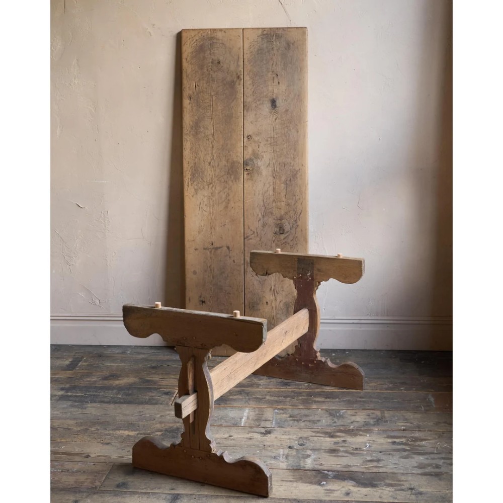 An 18th-century Swedish pine dining table featuring a rectangular plank top resting on a sculpted trestle base with a central stretcher. View II