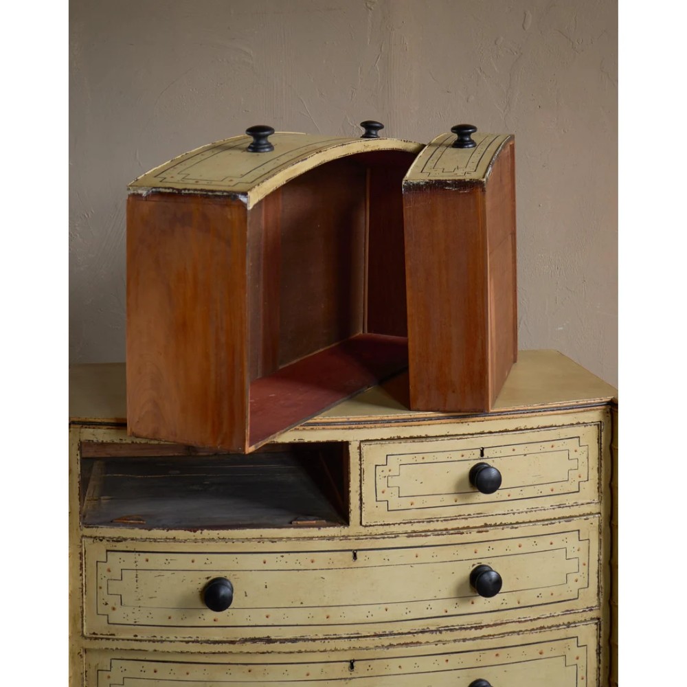 A Regency pale yellow painted chest of drawers featuring simulated bamboo turned corner columns and dark turned knobs. View VIII