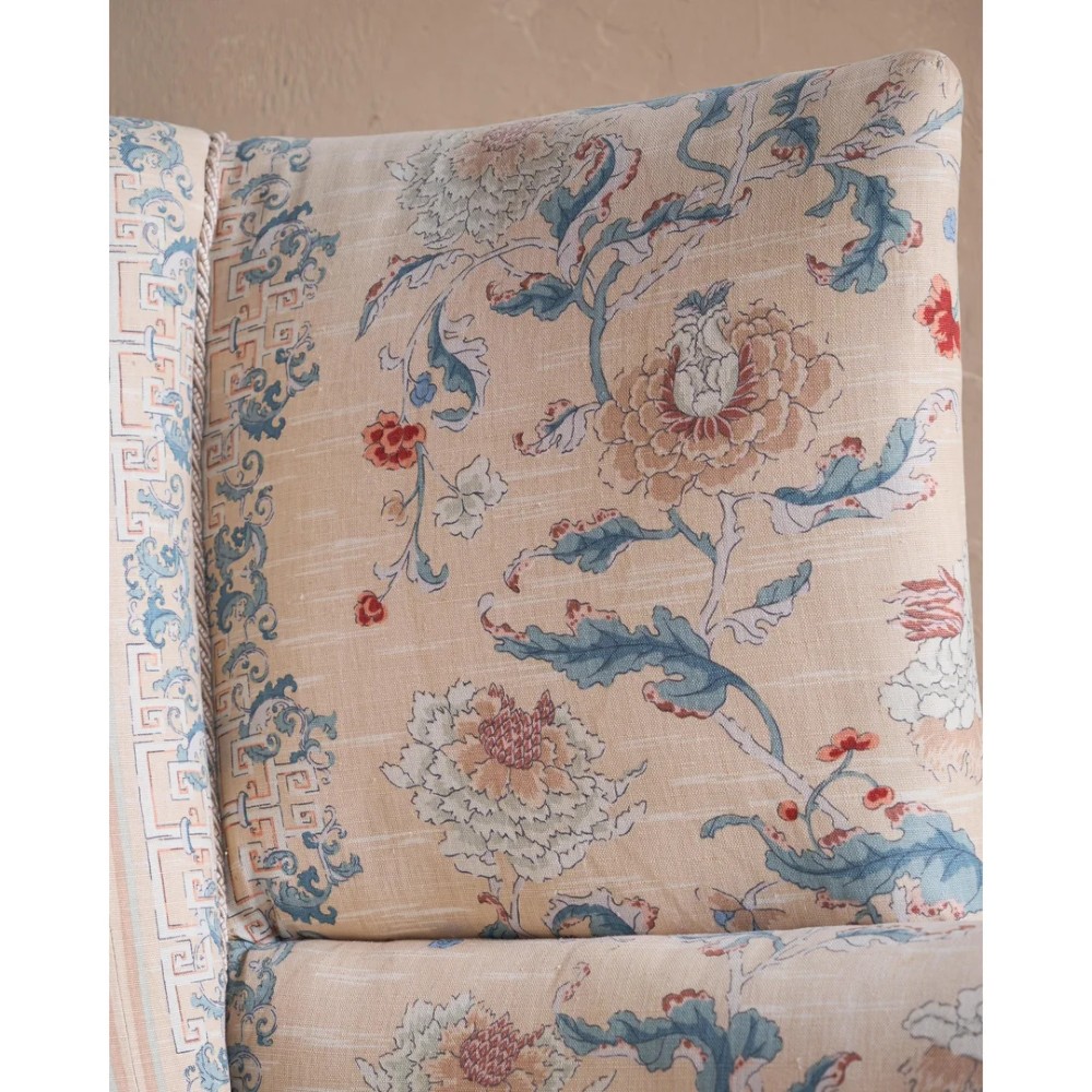 A nineteenth-century fluted wingback sofa featuring patterned floral upholstery, vertical channel tufting, and turned timber legs with brass castors. View XI