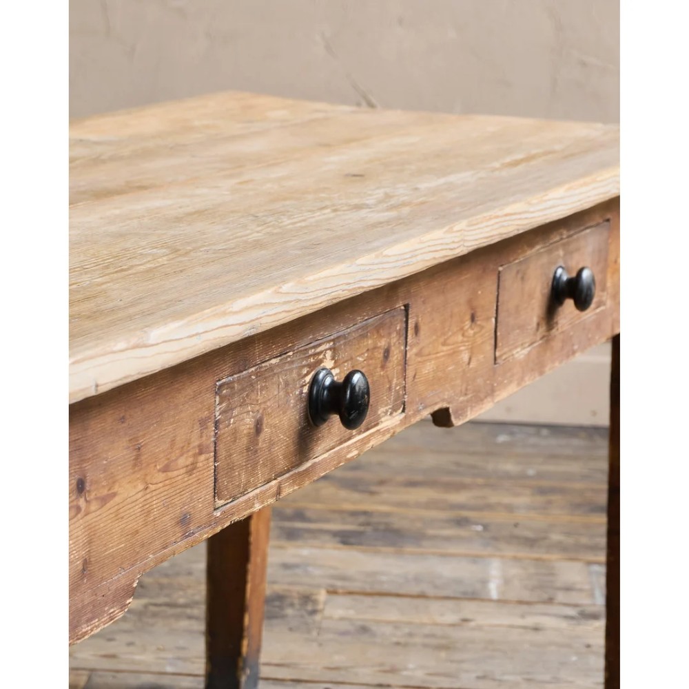 A long natural pine scullery table featuring three drawer fronts with dark wooden knobs and straight legs. View VI