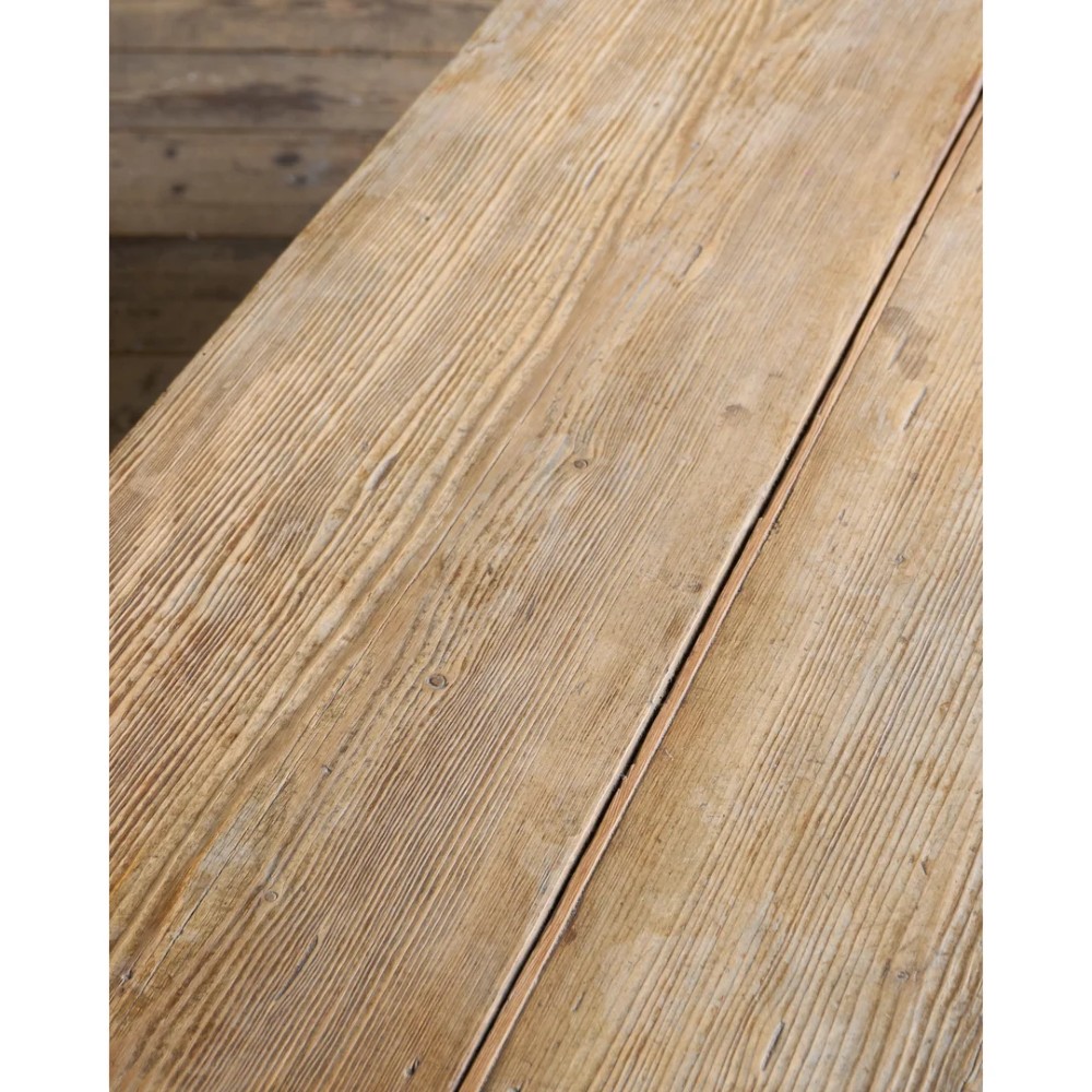 A long natural pine scullery table featuring three drawer fronts with dark wooden knobs and straight legs. View XII
