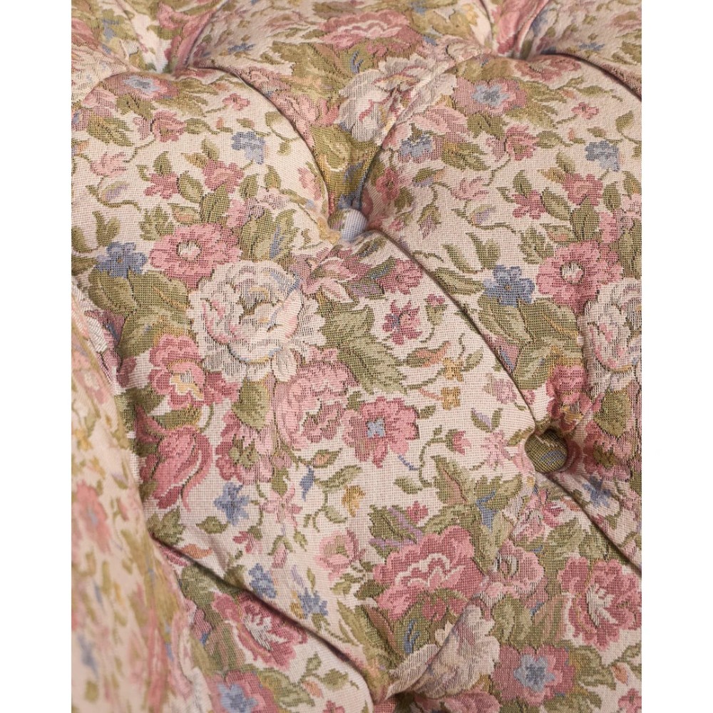 A nineteenth-century Chesterfield sofa with patterned floral upholstery, deep button tufting on the backrest and rolled arms, loose seat cushions, and turned legs on brass castors. View XII