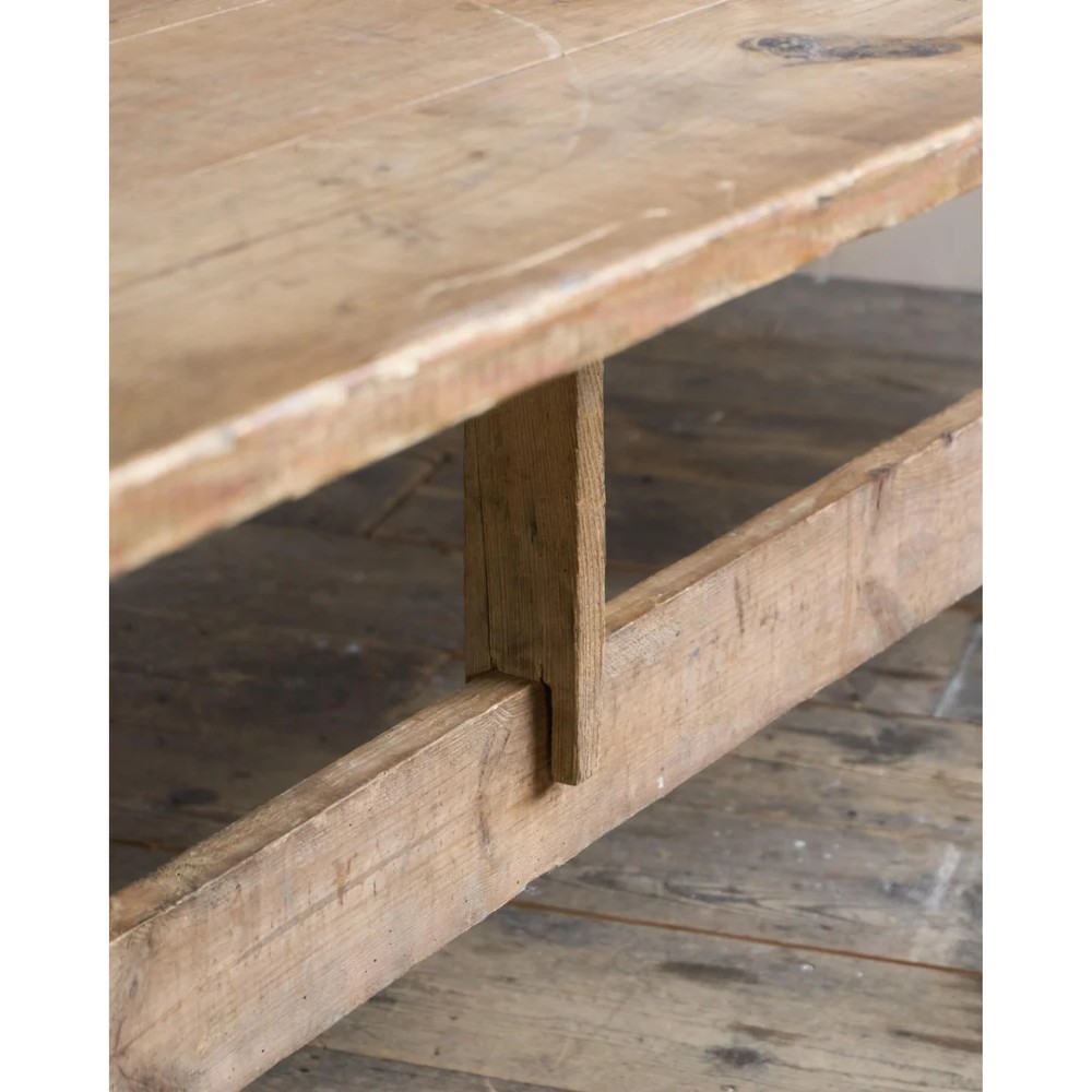A long, narrow rustic wooden dining table featuring a thick plank top supported by X-frame trestle legs and a longitudinal stretcher. View VIII