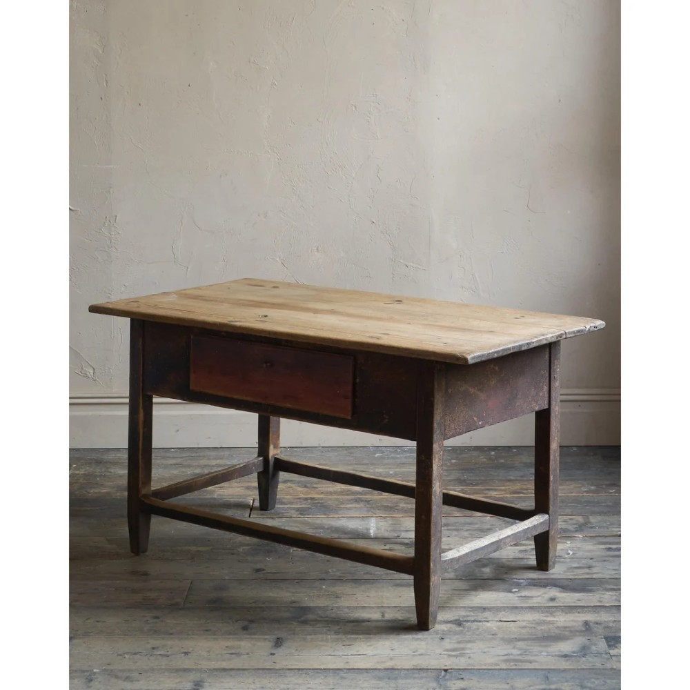 A rustic Swedish painted pine table featuring a scrubbed rectangular top, single frieze drawer, and dark painted base with box stretchers. View VI