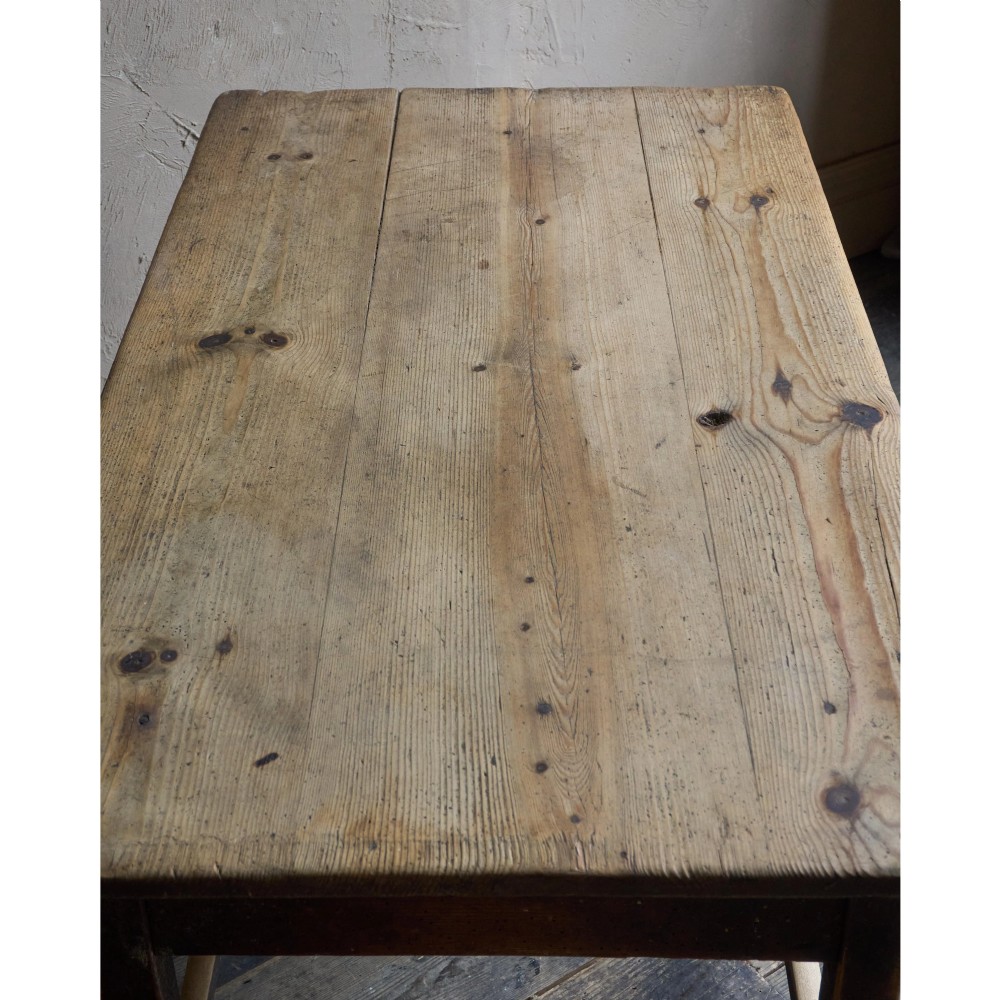 A rustic Swedish painted pine table featuring a scrubbed rectangular top, single frieze drawer, and dark painted base with box stretchers. View VIII