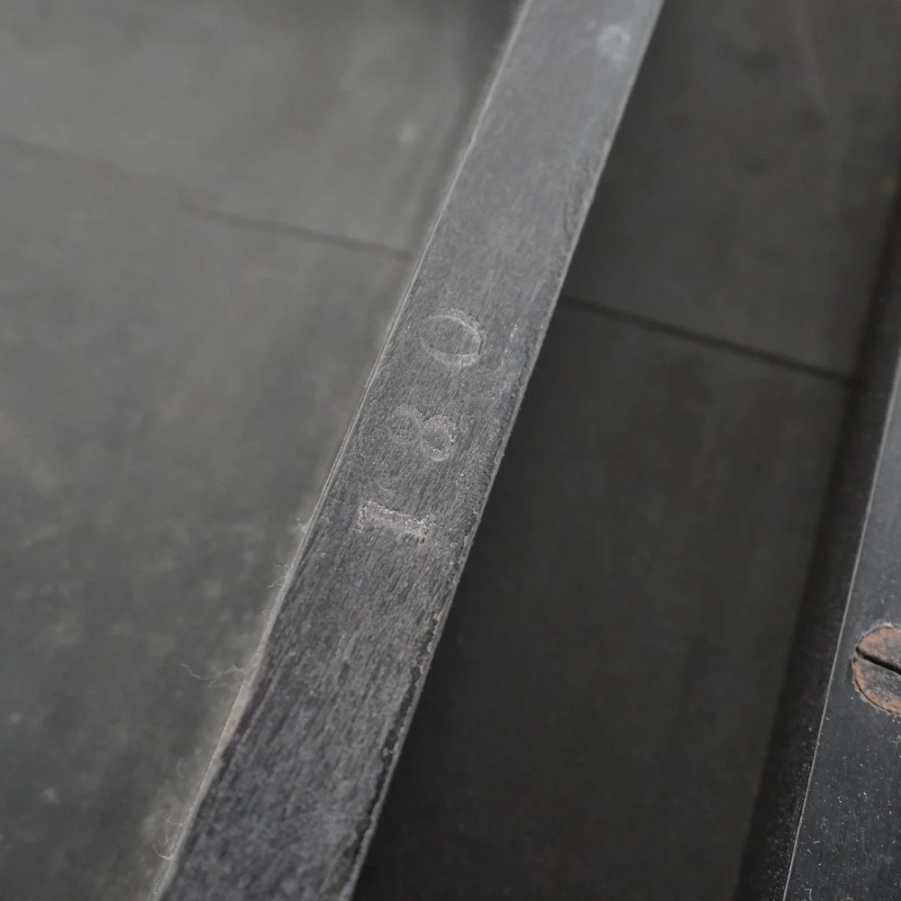 A square ebonised wood side table featuring slender turned legs connected by a lower square stretcher frame. View XII