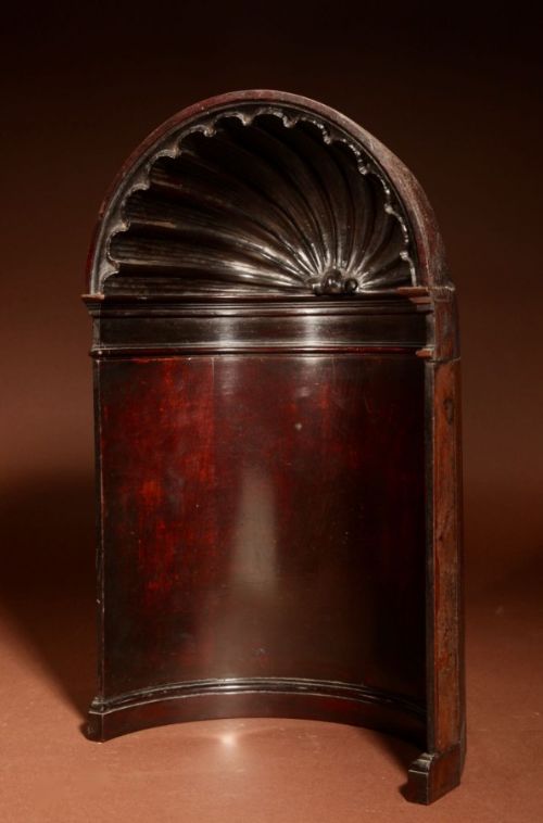 fig 1. A dark mahogany architectural alcove model featuring a carved shell motif arched dome top and a semi-circular curved back panel.