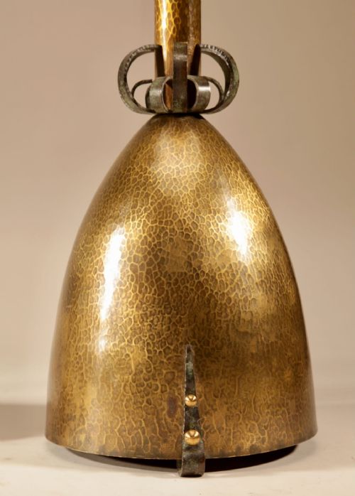 fig 1. A pair of tall hand-hammered brass pricket candlesticks featuring bell-shaped bases and openwork wrought iron scroll collars.