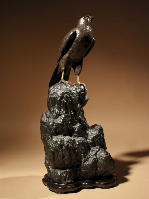 A Very Decorative Bronze Model of a Hawk Sitting on a Craggy Rock.