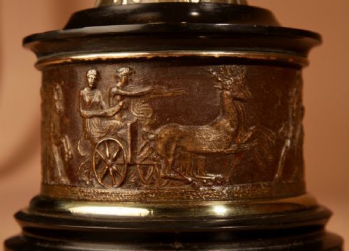A 19th-century Grand Tour table lamp featuring a black ceramic urn base with red-figure chariot artwork, gilt bronze handles, and a pleated conical fabric shade. View VII