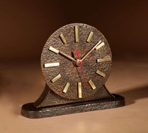 A Very Stylish Amsterdam School Hammered Patinated Brass Early Electrical Mantel Clock.
