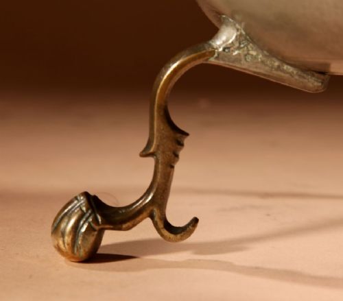 An 18th-century Dutch pewter kraantjeskan coffee urn featuring a bronze spigot tap, curved side handles, and three cabriole feet. View X