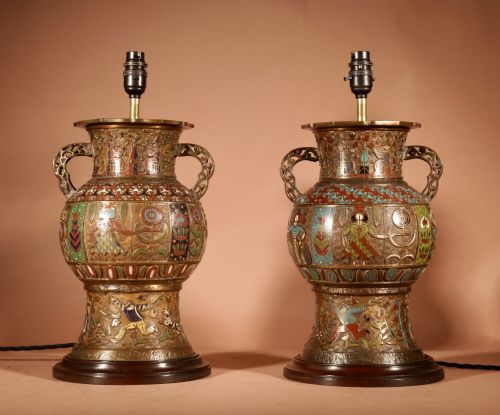 fig 1. A pair of large Japanese champleve enamel bronze vase-form table lamps with twin handles and off-white pleated shades.