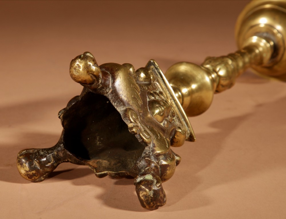 A pair of 17th-century Flemish turned brass pricket candlesticks with spiral shafts and ornate tripod claw feet. View VIII