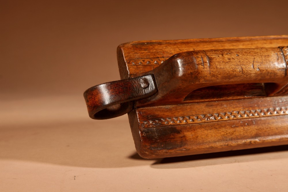A hand-carved 18th-century Norwegian wooden mangle board with geometric chip carving, dated 1728, featuring a raised carved handle at one end. View XI