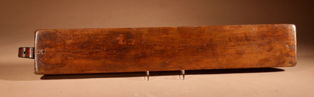 A hand-carved 18th-century Norwegian wooden mangle board with geometric chip carving, dated 1728, featuring a raised carved handle at one end. View XII