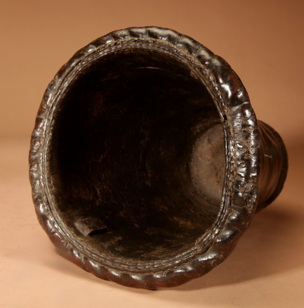 An 18th-century dark brown leather fire bucket featuring a tall stitched leather handle, a thick rolled rim, and hand-painted cream lettering reading BRESYL ANNO 1776. View XI