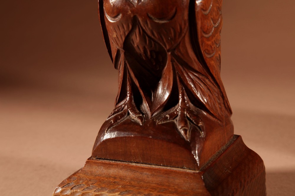 A pair of hand-carved dark wood owl figures with glass eyes mounted on carved wooden bases. View XIII