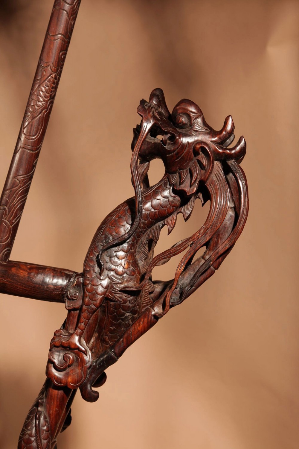 A large 19th-century Chinese ceremonial stand crafted from dark carved hardwood displaying a fan-shaped arrangement of polearms topped with brass finials. View IV
