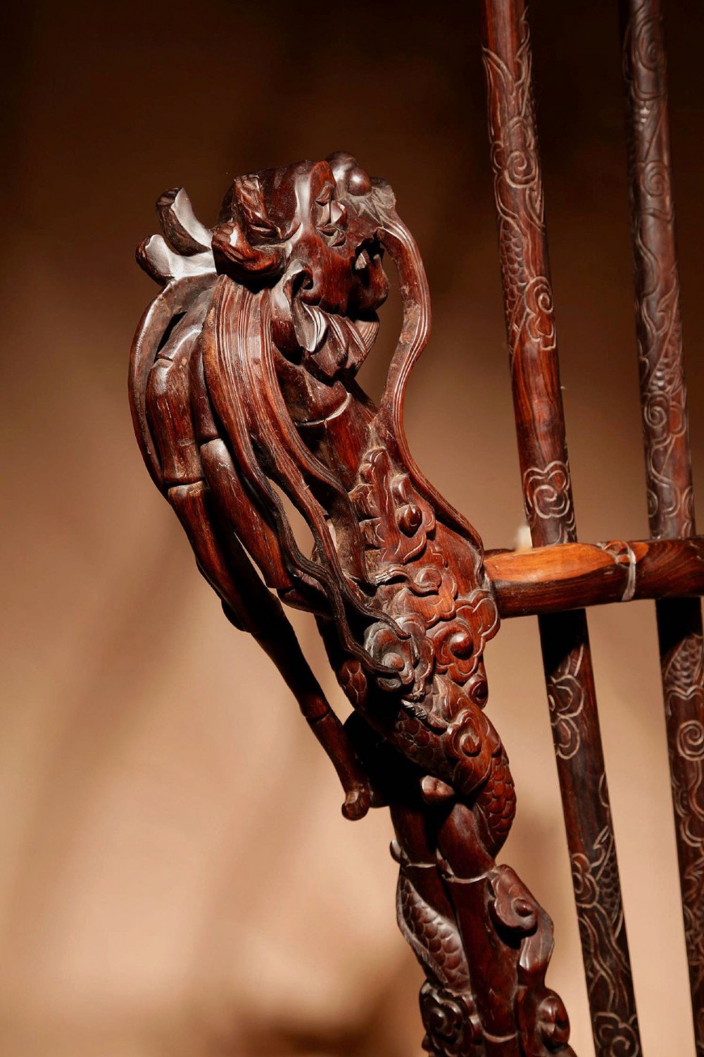 A large 19th-century Chinese ceremonial stand crafted from dark carved hardwood displaying a fan-shaped arrangement of polearms topped with brass finials. View X