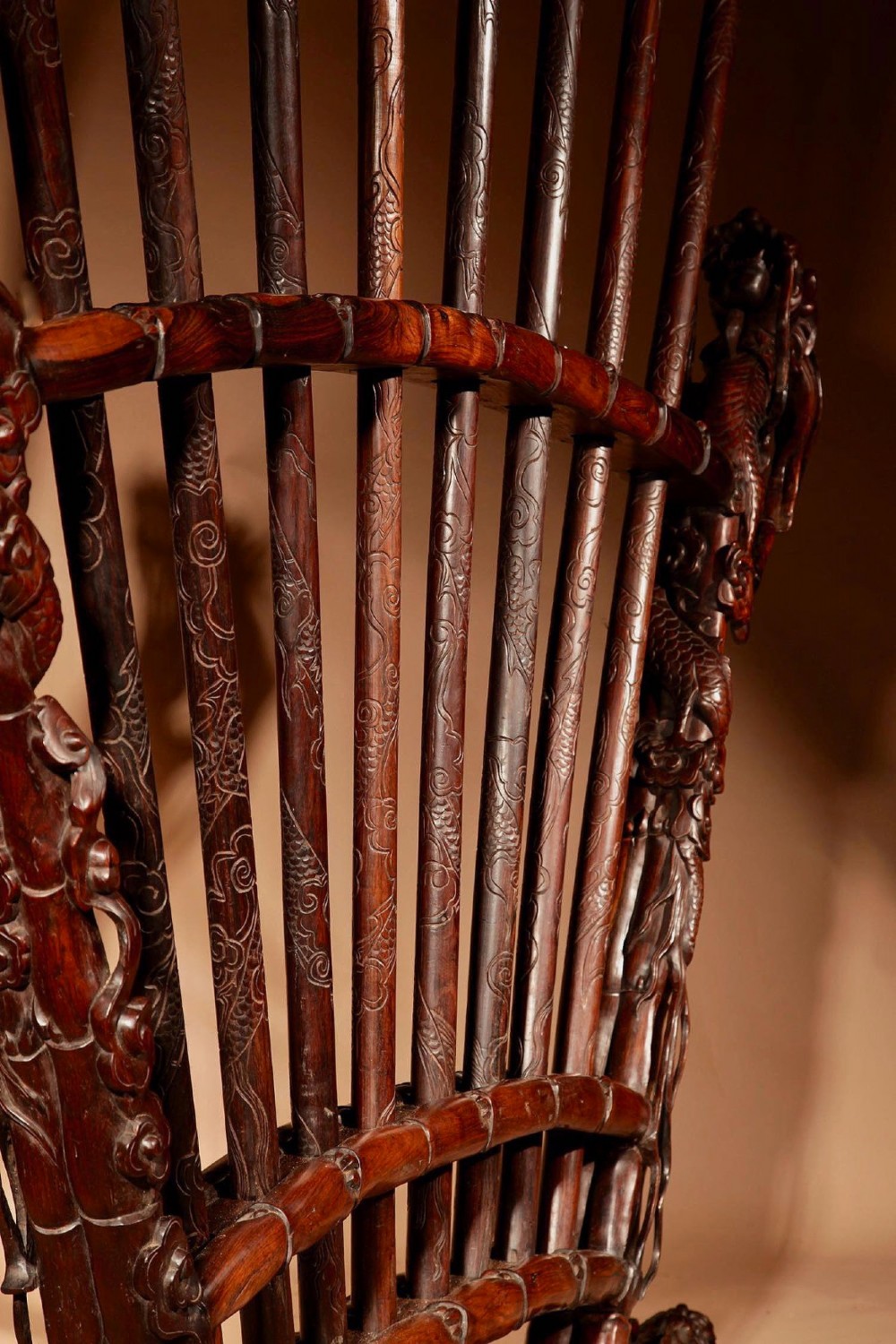 A large 19th-century Chinese ceremonial stand crafted from dark carved hardwood displaying a fan-shaped arrangement of polearms topped with brass finials. View XIII