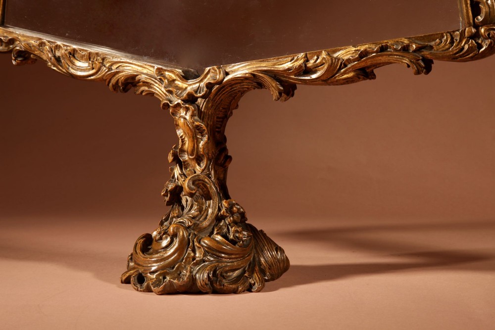 A fan-shaped glazed display case on an ornate Rococo style gilt metal pedestal base decorated with acanthus leaf scrollwork. View IV