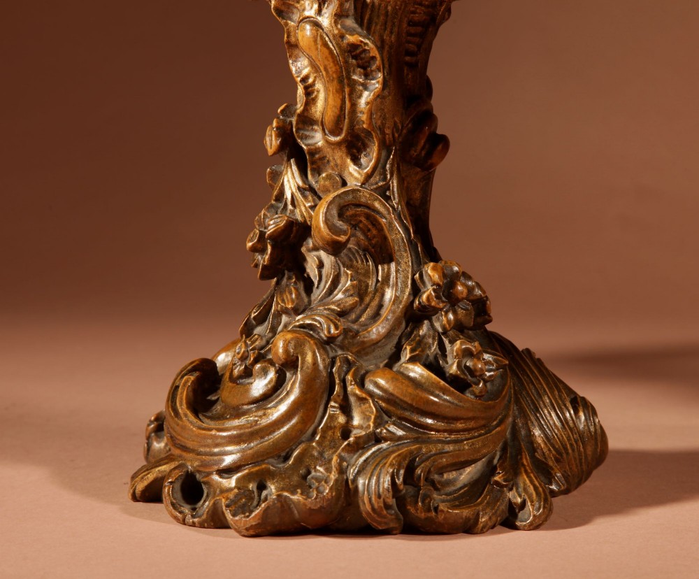 A fan-shaped glazed display case on an ornate Rococo style gilt metal pedestal base decorated with acanthus leaf scrollwork. View V