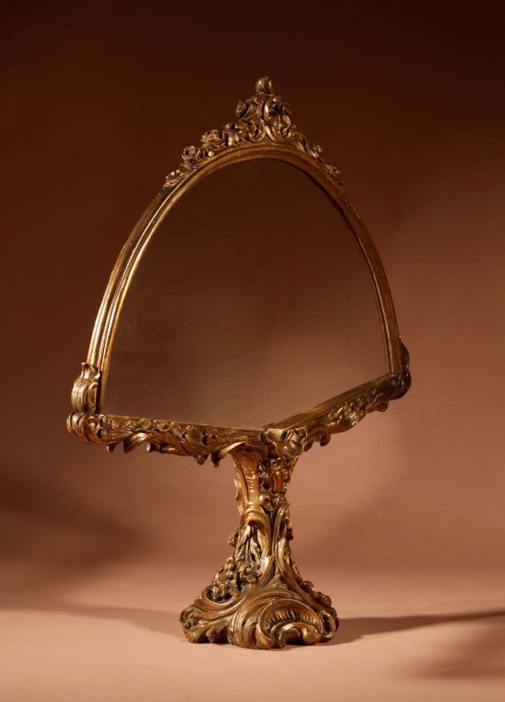 A fan-shaped glazed display case on an ornate Rococo style gilt metal pedestal base decorated with acanthus leaf scrollwork. View VII