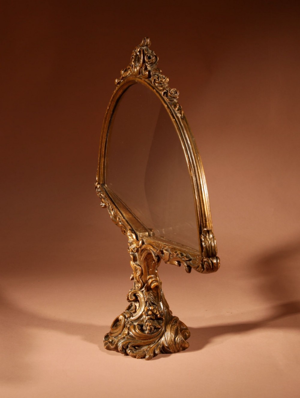 A fan-shaped glazed display case on an ornate Rococo style gilt metal pedestal base decorated with acanthus leaf scrollwork. View VIII