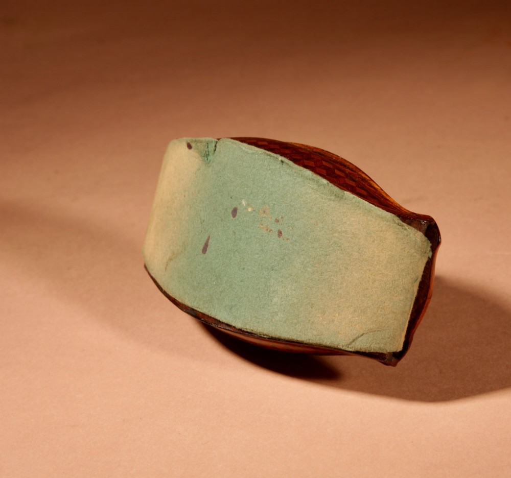 A nineteenth-century French rocker blotter featuring geometric wood parquetry inlay, a green felt underside, and a sculpted gilt bronze cherub head handle. View XIV