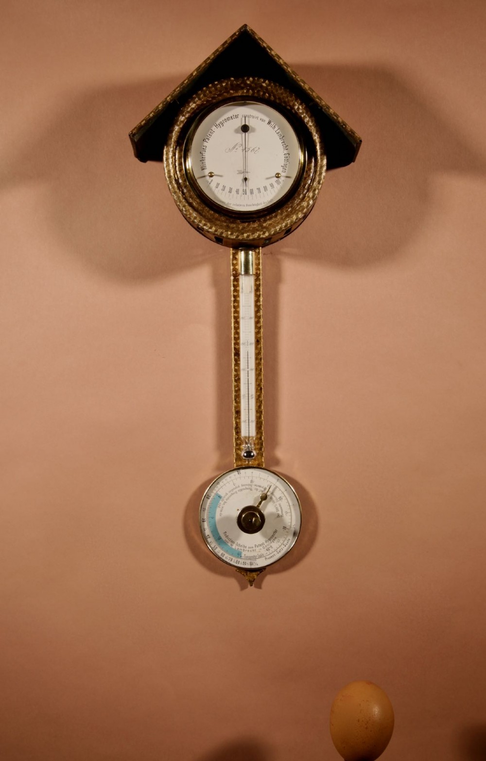 An antique late nineteenth-century brass wall-mounted Klinkerfues patent hair hygrometer weather station featuring two circular dials and a central thermometer tube. View II