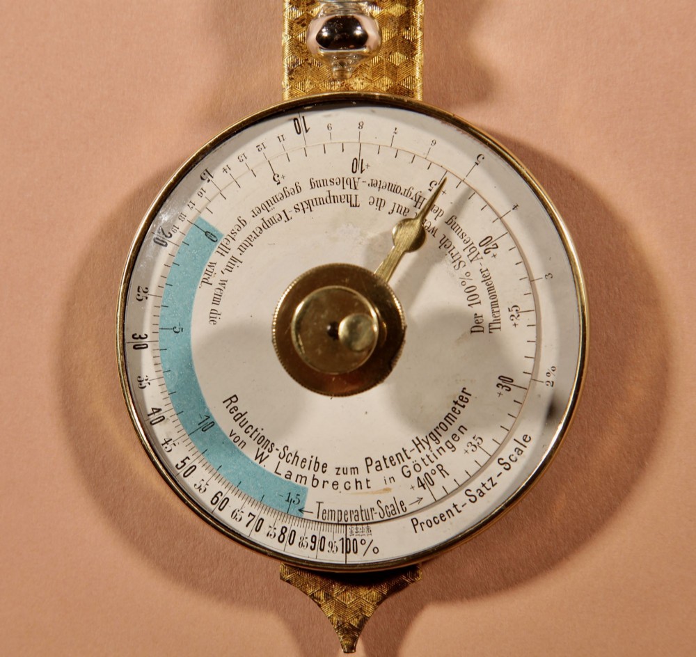 An antique late nineteenth-century brass wall-mounted Klinkerfues patent hair hygrometer weather station featuring two circular dials and a central thermometer tube. View VIII